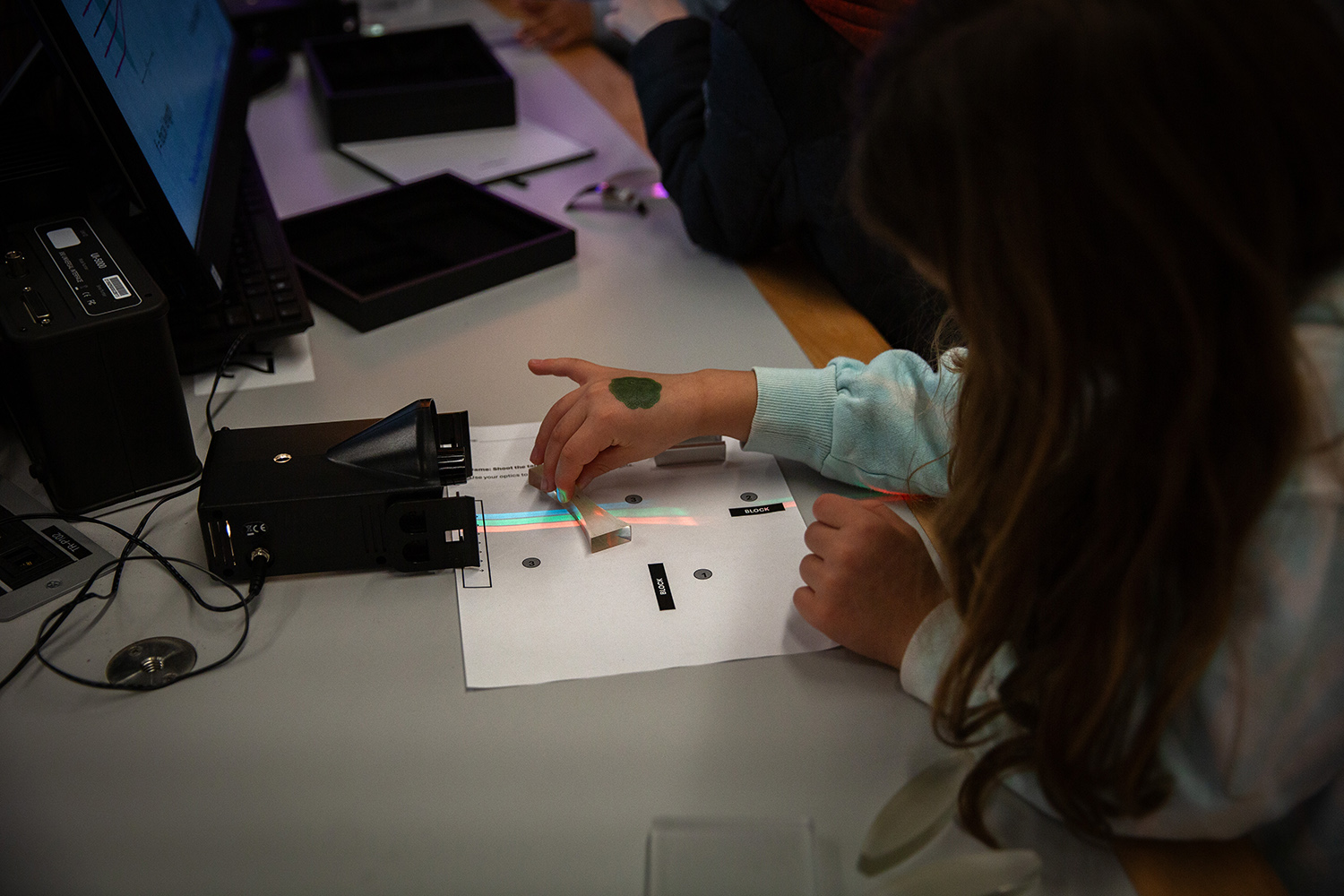 A student performs a physics activity.