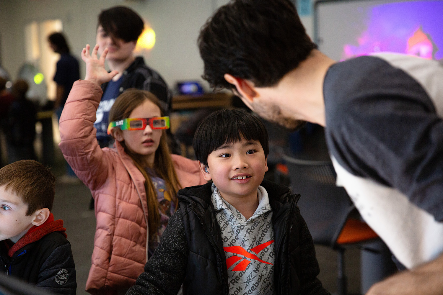 Students meet with a physics professor on UConn's main campus in Storrs.