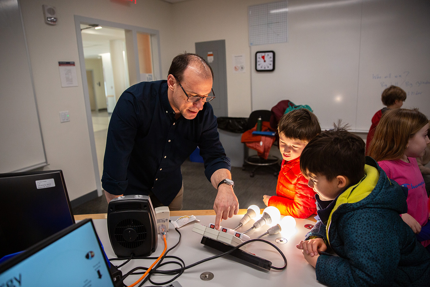 Carlos Trallero explains an activity to students.