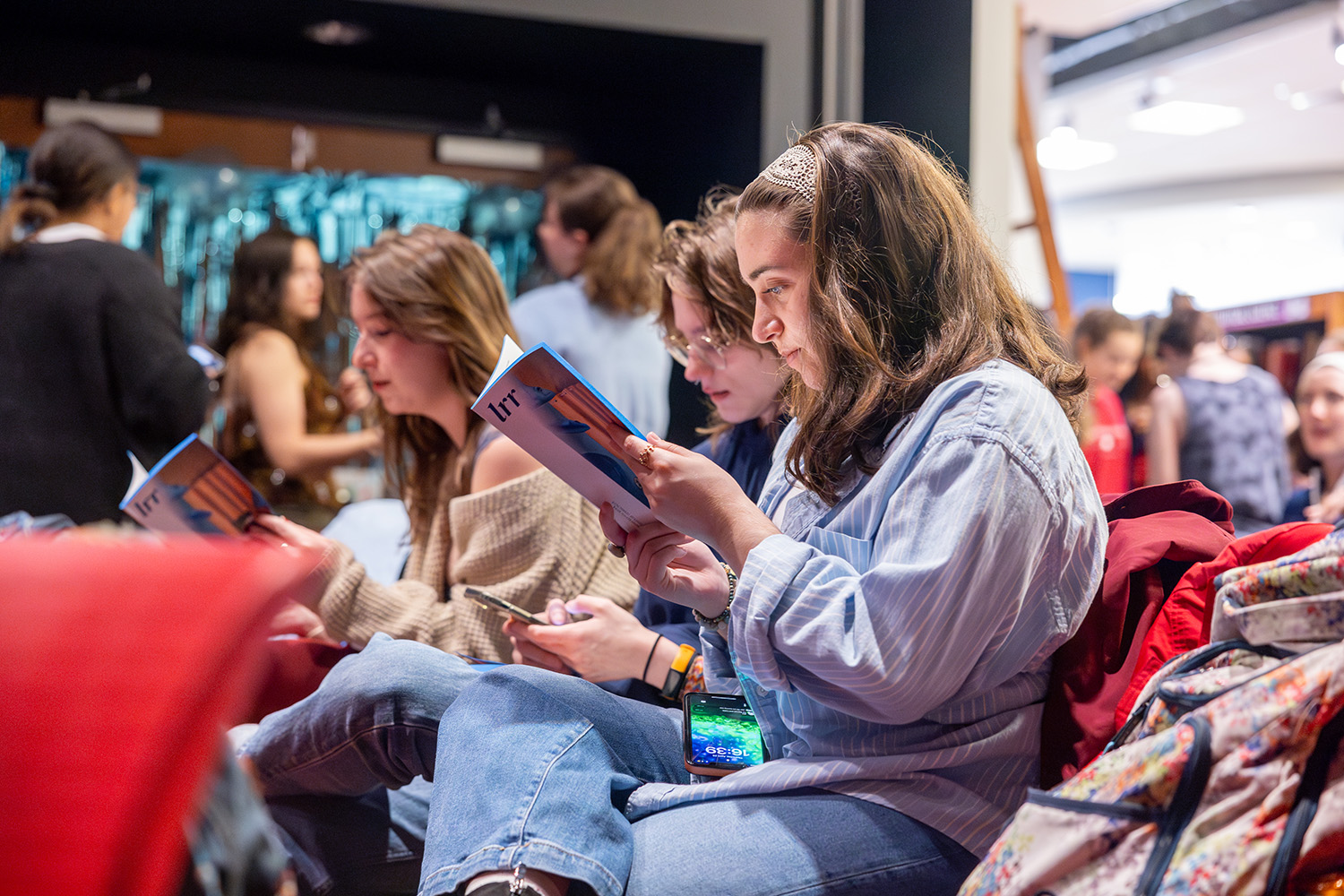 Audience members look through recently published book.