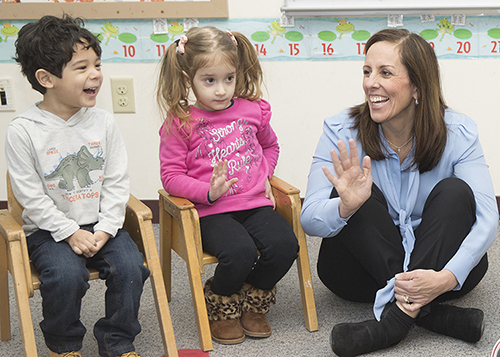 Christine Carver on the right with two elementary students.