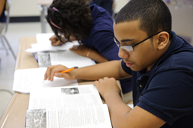 Sixth-graders work on writing projects with teacher Kim Albro at Dr. Joseph S. Renzulli Gifted and Talented Academy in Hartford on Dec. 14, 2011. (Peter Morenus/UConn File Photo)