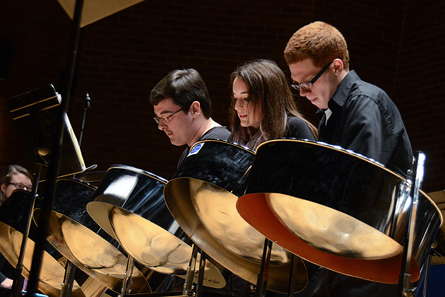 Alexander Gaffney, left, Luci Chaplin, and Ryan Royle perform at the Steel Pan Ensemble held in von der Mehden Recital Hall on Dec. 4, 2011. (Ariel Dowski/UConn Photo)