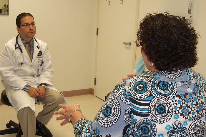 Patient Deborah Galiette (right) believes she would have suffered a life-threatening heart attack had she not enrolled in the PROMISE study, led by Dr. Erick Avelar (left). (Chris DeFrancesco/UConn Health Center Photo)