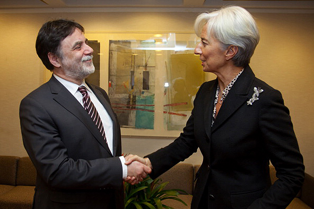 IMF Managing Director Christine Lagarde greets Hungarian political minister Tamas Fellegi at IMF Headquarters January 12, 2012 in Washington, DC. (Photo by Stephen Jaffe/IMF via Getty Images)