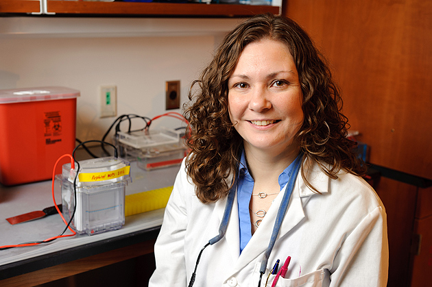 Janet Paulsen, a graduate student, in the lab on Feb. 21, 2012. (Peter Morenus/UConn Photo)