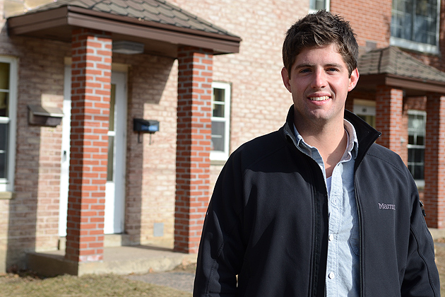 Alumni Stephen Fortin poses for a portrait by Mansfield Apartments on Feb. 4, 2012. (Ariel Dowski/UConn Photo)