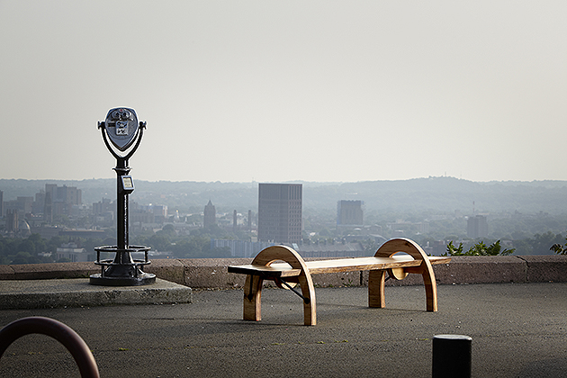 This bench, created by Ted and Zeb Esselstyn, is made from wood from the largest elm tree in the state which came down in Suffield, CT in 2009. The photo was taken in East Rock Park, overlooking New Haven. (Photo by Derek Dudek)