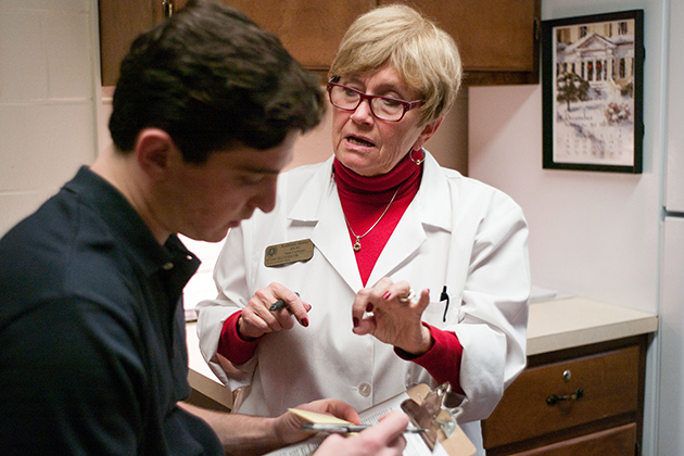 Kathleen Sanner, RN-BC, immunizes a patient at Student Health Services on Dec. 10, 2012. (Peter Morenus/UConn Photo)