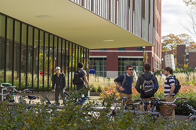 Male students talking outside of Laurel Hall, which has now been renamed the Lawrence D. McHugh Hall. (FJ Gaylor/UConn Photo)