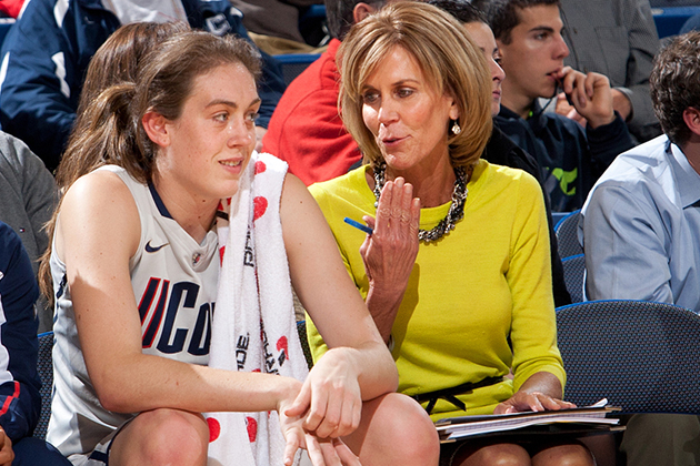 Associate Head Coach Chris Dailey on the bench during a game. (Photo courtesy of UConn Athletics)