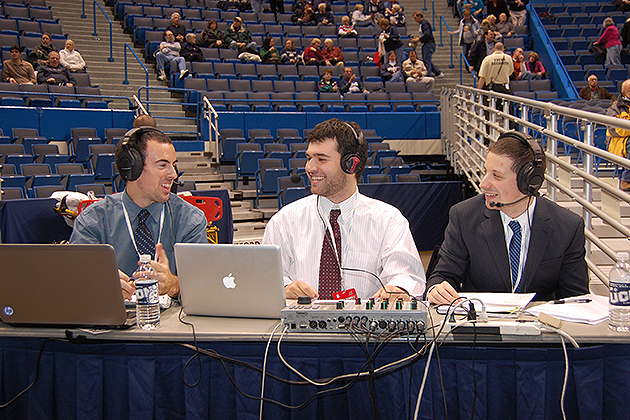 The WHUS crew, (l to r) Josh Baron'13 (CLAS), John Ponziani '13 (CLAS), and Spencer Warshaue '14 (ENG) prepare to broadcast a basketball game at the XL Center in Hartford. (Ken Best/UConn Photo)