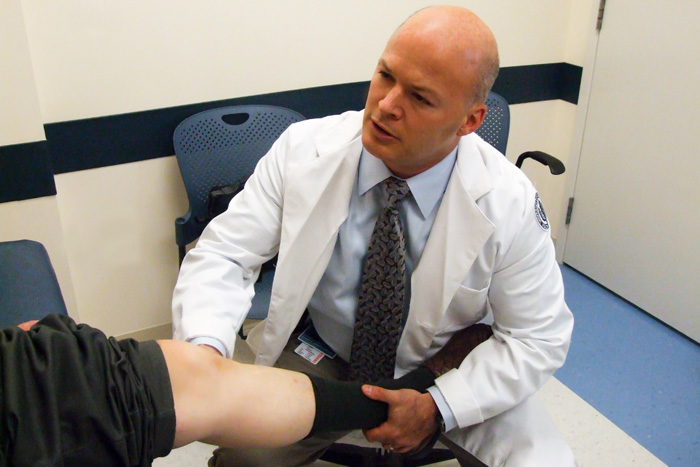 Dr. Thomas DeBerardino with a patient in the MARB on August 5, 2009. (Chris DeFrancesco/UConn Health Center Photo)