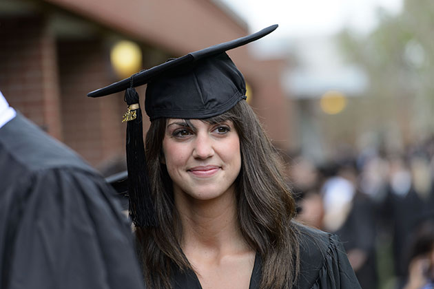 Erin Dinnan of Southington walks along with classmates during the entrance procession of the College of Liberal Arts and Sciences commencement ceremony at Harry A. Gampel Pavilion on May 12, 2013. (Peter Morenus/UConn Photo)