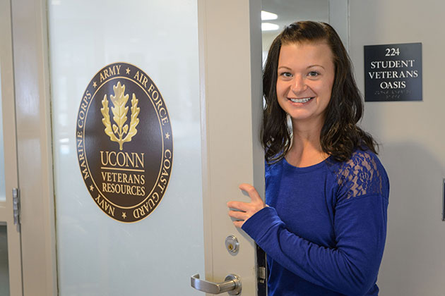 Catherine Jones '16 (CLAS) poses for a photo outside the Student Veterans Oasis at the Student Union on Oct. 22, 2013. (Peter Morenus/UConn Photo)