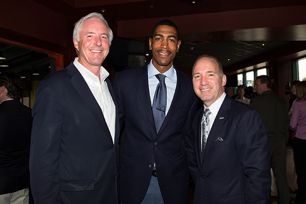 Bridgeport mayor Bill Finch '79 (CANR), left, men's basketball head coach Kevin Ollie '95 (CLAS), and Howard Saffan, president of Harbor Yard Sports and Entertainment, after a press event on Oct. 7, 2013 announcing that the men's and women's basketball teams will each play a games in Bridgeport during the 2013-2014 season. (Stephen Slade '89 (SFA) for UConn)