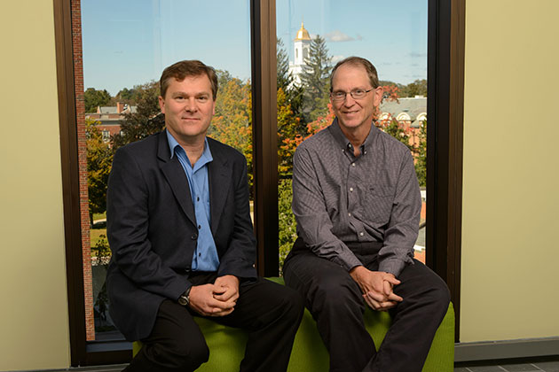 Steven Smith, assistant professor of journalism, left, and Michael Stanton, associate professor of journalism at Oak Hall on Sept. 25, 2013. (Peter Morenus/UConn Photo)