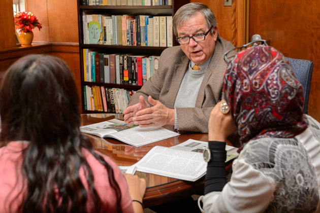 Walter Woodward, associate professor of history, meets with honors students Reem Elazazy '16 (CLAS), right, Halima Khan '16 (CLAS), Hayley Snell '16 (CLAS), and Moeizza Malik '16 (CLAS) on Nov. 4, 2013. (Peter Morenus/UConn Photo)