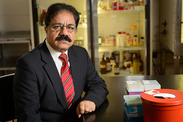 Mazhar Khan, professor of pathobiology, on Dec. 4, 2013. (Peter Morenus/UConn Photo)