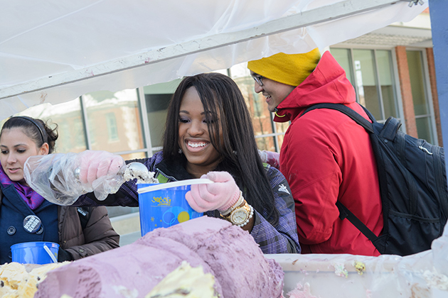 Students scoop ice cream during Subog's One Ton Sundae on the Student Union patio on Feb. 7, 2014. (Ariel Dowski/UConn Photo)