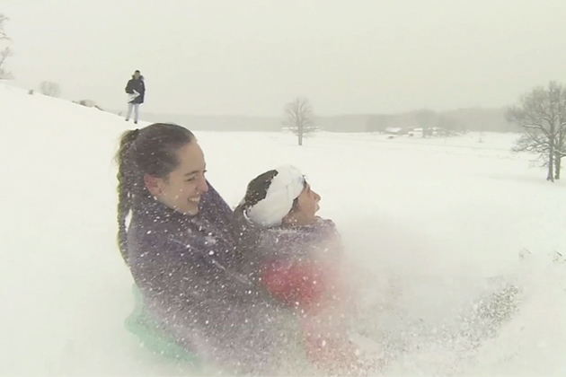 Sledding on Horsebarn Hill, Feb. 13, 2014 (Cody Carver/UConn Photo)