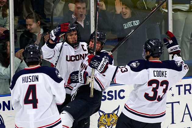 The Men's Hockey team celebrates a goal. (Steve Slade '89 (SFA) for UConn)