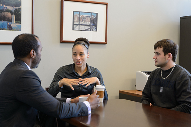 Jeffrey Ogbar, vice provost for diversity, left, Shantel Honeyghan '15 (CLAS), and Hasudin Pehratovic '15 (BUS). (Peter Morenus/UConn Photo)