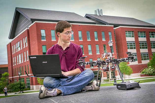 Rosse Gates '16 (ENG) with a quadcopter he built, supported by an IDEA Grant. (Christopher LaRosa/UConn Photo)