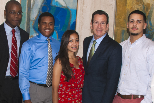 From left: Philip Montgomery, Julian Rose and Kitsha Alvarado, and Jeremy Figueroa-Ortiz (right) are among more than 200 graduates of Aetna Health Professions Partnership programs at UConn Health. Gov. Dannel P. Malloy was the keynote speaker at their closing ceremony Friday. Dr. Marja Hurley (right) is director of the Health Career Opportunity Programs at UConn Health. Photo by Janine Gelineau