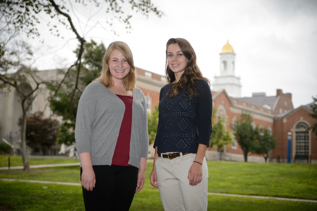 Incoming freshmen Megan Boyer and Sarah Robbins, a valedictorian and salutatorian respectively, from Manchester High School outside the Wilbur Cross Building on Aug. 22, 2014. (Peter Morenus/UConn Photo)