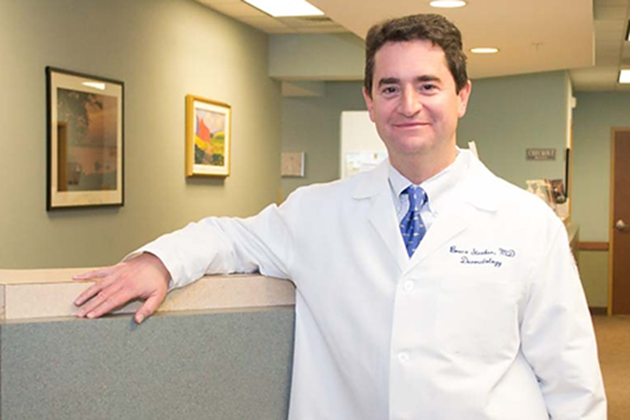 Dr. Bruce Strober, associate professor and vice chair of the Department of Dermatology at UConn Health, pictured in the dermatology clinical offices in Farmington. (Tina Encarnacion/UConn Health Photo)