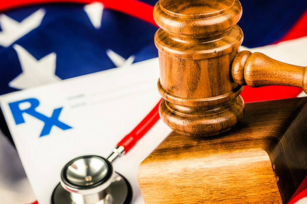 Photo illustration of gavel, stethoscope, prescription pad, and the American flag. (iStock Photo)