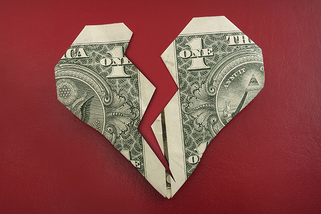 A torn dollar heart. (iStock Photo)