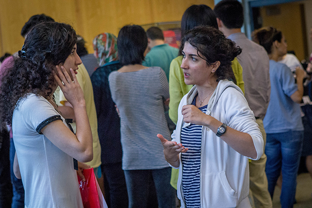 Graduate students in engineering socialize during an ice cream social hour. (Christopher LaRosa/UConn Photo)