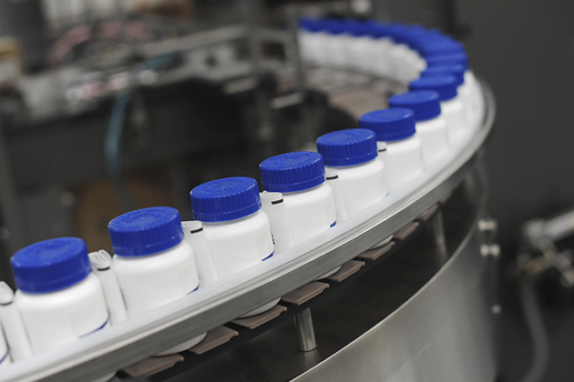 Pill bottles at a manufacturing plant. (iStock Photo)