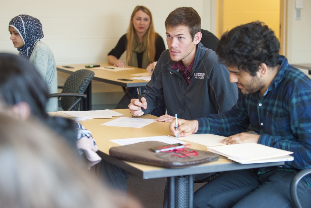 Student-athlete Istvan Kanyo, a walk-on defense player on the men's soccer team, in class on Nov. 18, 2015. (Sean Flynn/UConn Photo)