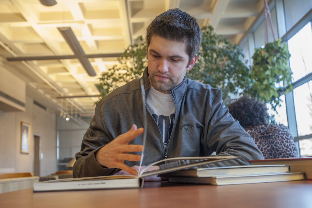 Student-athlete Kyle Huson studying at the Homer Babbidge Library on Jan. 12, 2016. (Sean Flynn/UConn Photo)