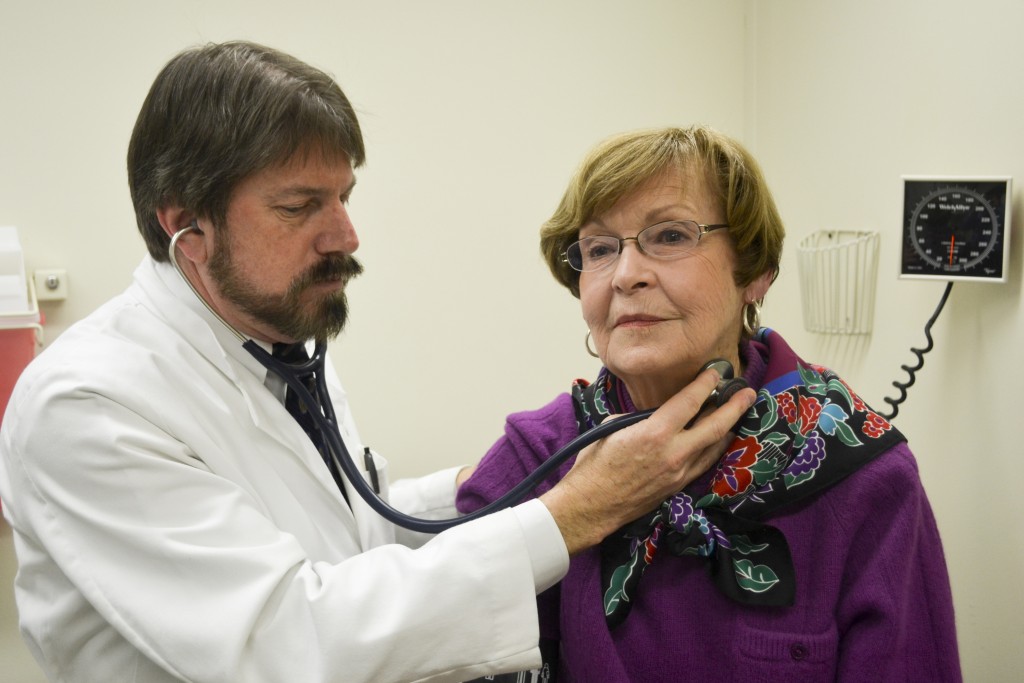 Dr. William White with a participant in a trial that studies out-of-office blood pressure as a predictor of cognitive and functional decline. (Chris DeFrancesco/UConn Health Photo)