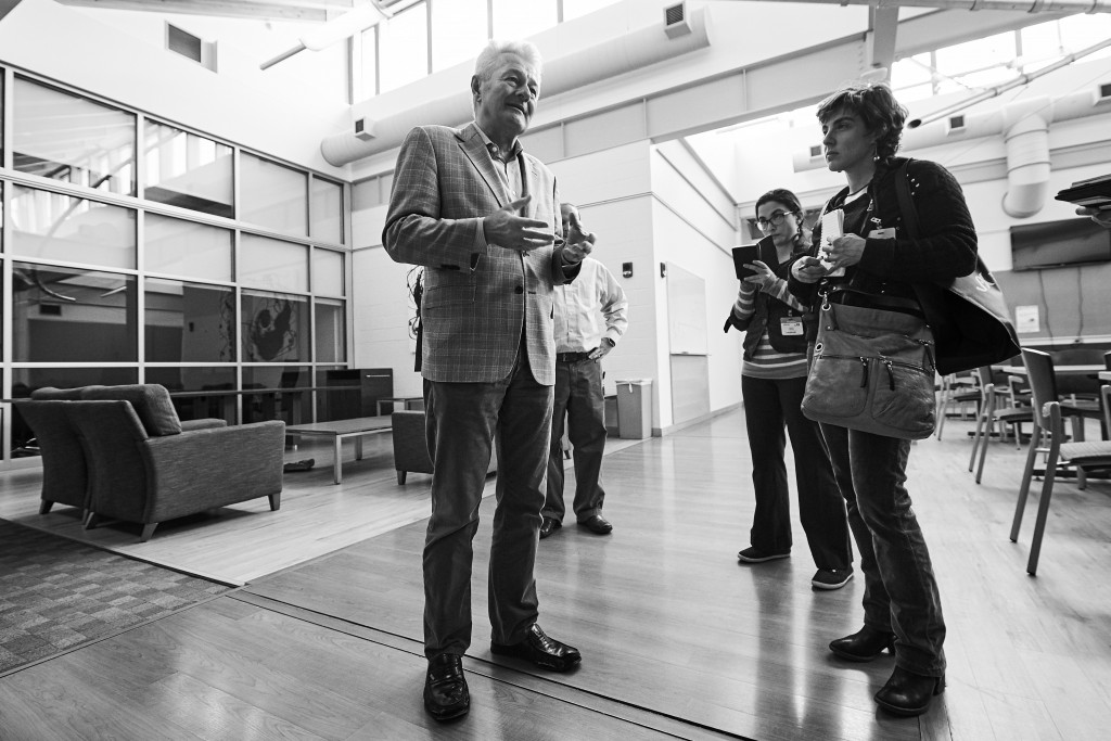 Reinhard Laubenbacher, professor of cell biology, speaks with journalists at the Cell and Genome Sciences Building in Farmington on March 15, 2016. (Peter Morenus/UConn Photo)