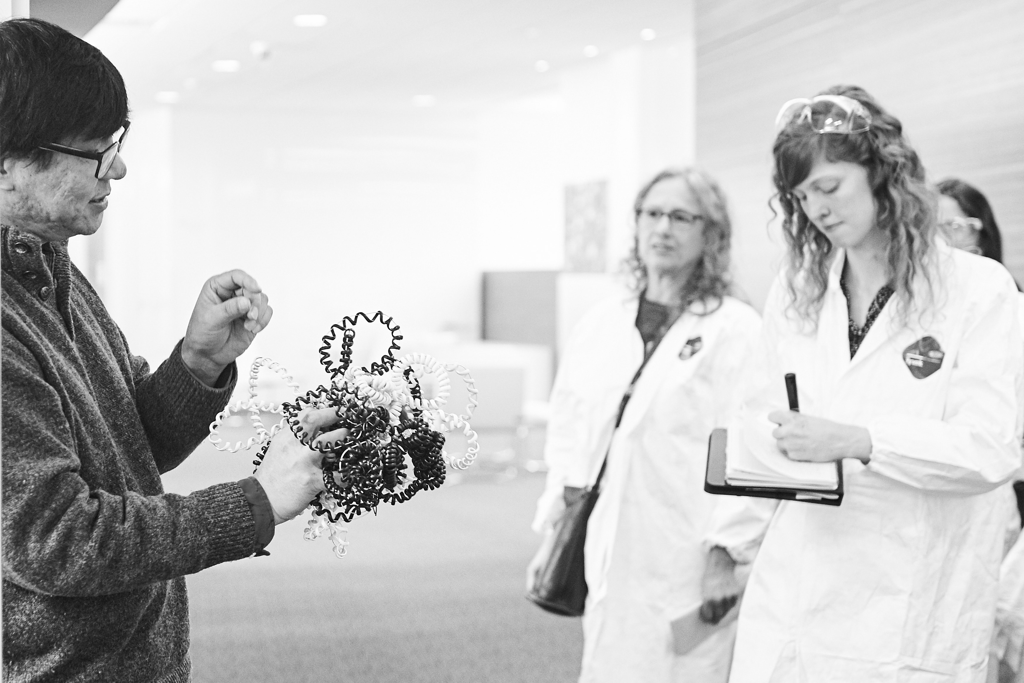 Yijun Ruan, professor, the Florine Deschenes Roux Chair, and director of genomic sciences at The Jackson Laboratory discusses his research and describes a model of the genome with journalists during a tour of The Jackson Laboratory for Genomic Medicine in Farmington. (Peter Morenus/UConn Photo)