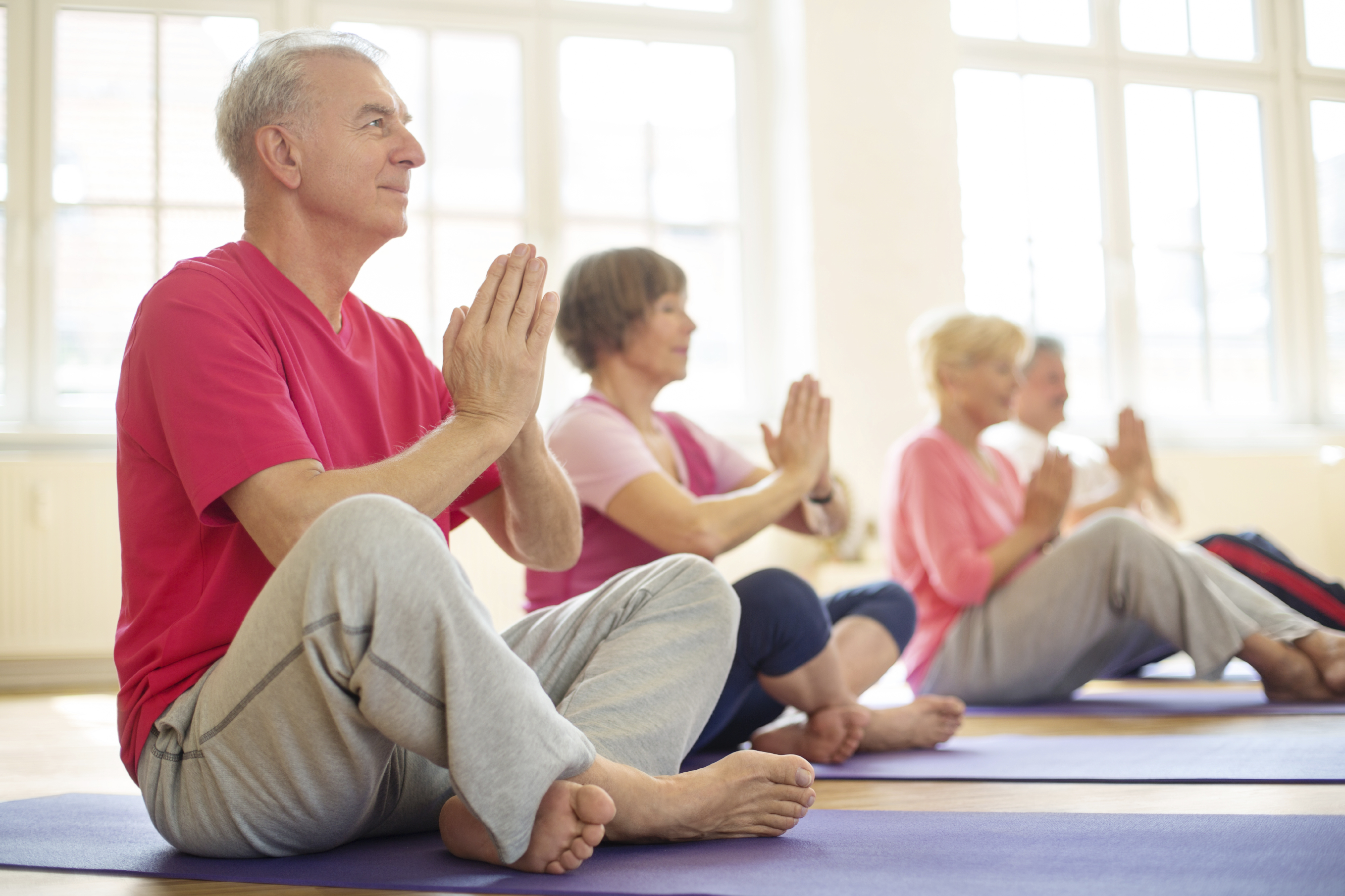 lder adults, both men and women, exercise together. (iStock Photo)