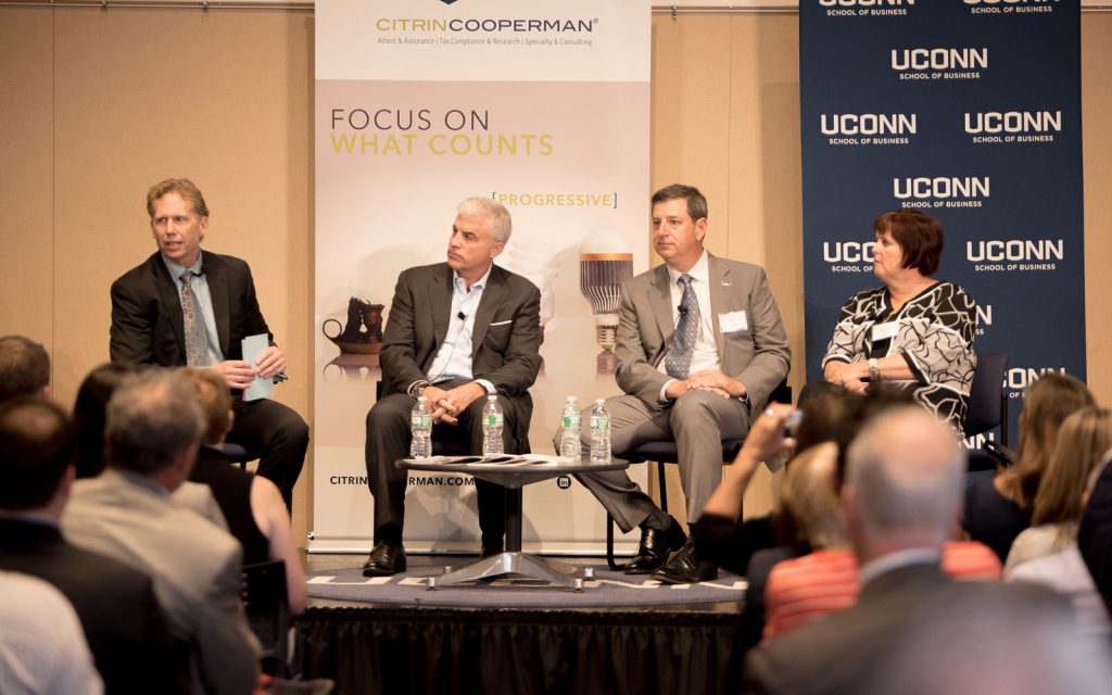 Left to right, Mark L. Fagan, Scott Gillis, Bill Simon and Margaret Keane discuss business values at the "CEO Evolution." (Nathan Oldham/UConn photo)