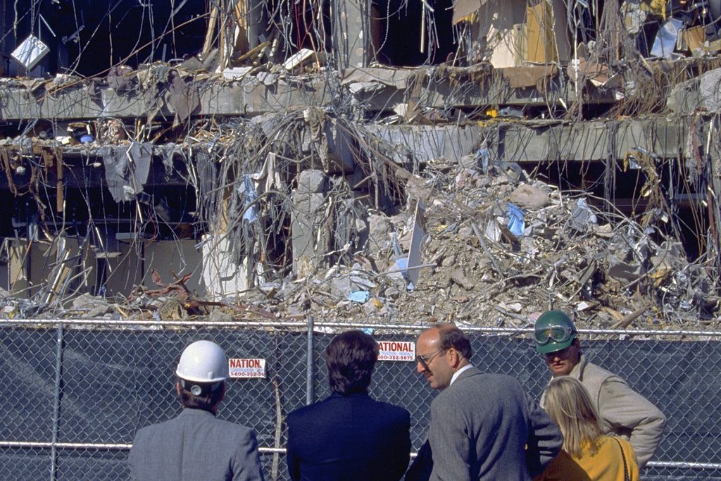 Northridge, California - January 19, 1994: Experts survey office building with one side entirely collapsed from the Martin Luther King Day earthquake. (iStock)