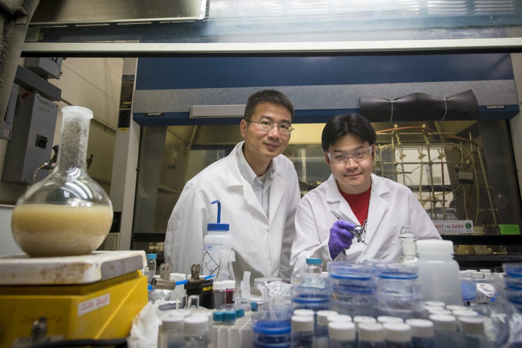 Luyi Sun, associate professor of chemical and biomolecular engineering, and graduate student Songshan Zeng have created a group of ‘smart’ materials that alter their color and transparency properties in response to mechanical force Photo taken on July 20, 2016. (Sean Flynn/UConn Photo)