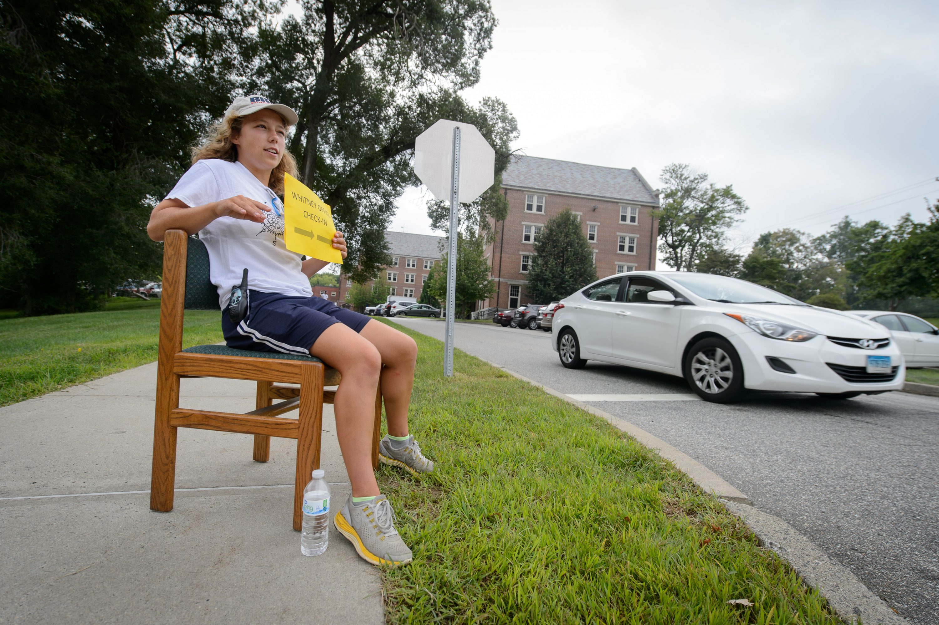 Amelia Tavarnesi '19 (CLAS) gives directions outside Holcomb Hall. (Peter Morenus/UConn File Photo)