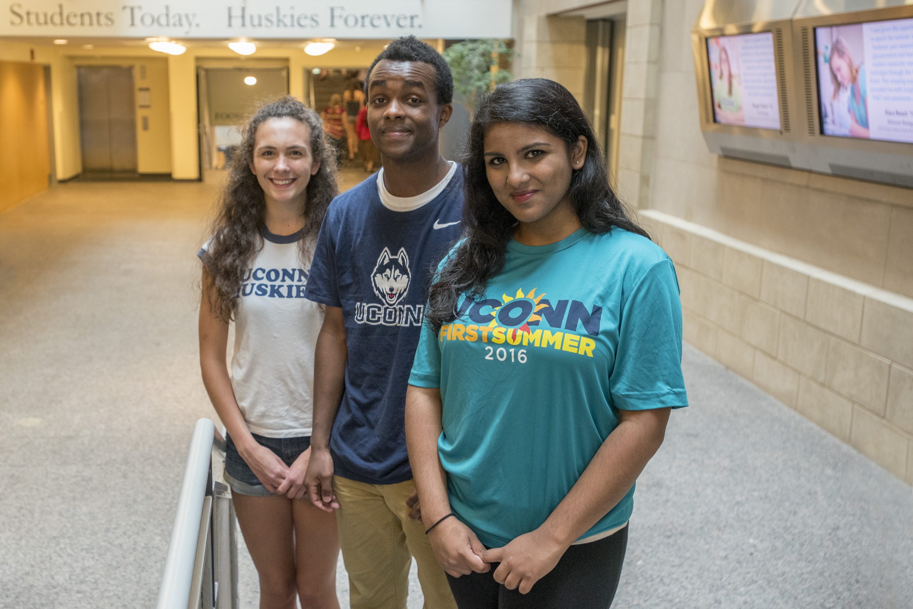 From left, Cyrene Nicholas of Branford, Naaol Shupare of Brooklyn Park, Minn., and Akriti Mishra of West Hartford, members of the Class of 2020. (Sean Flynn/UConn Photo)