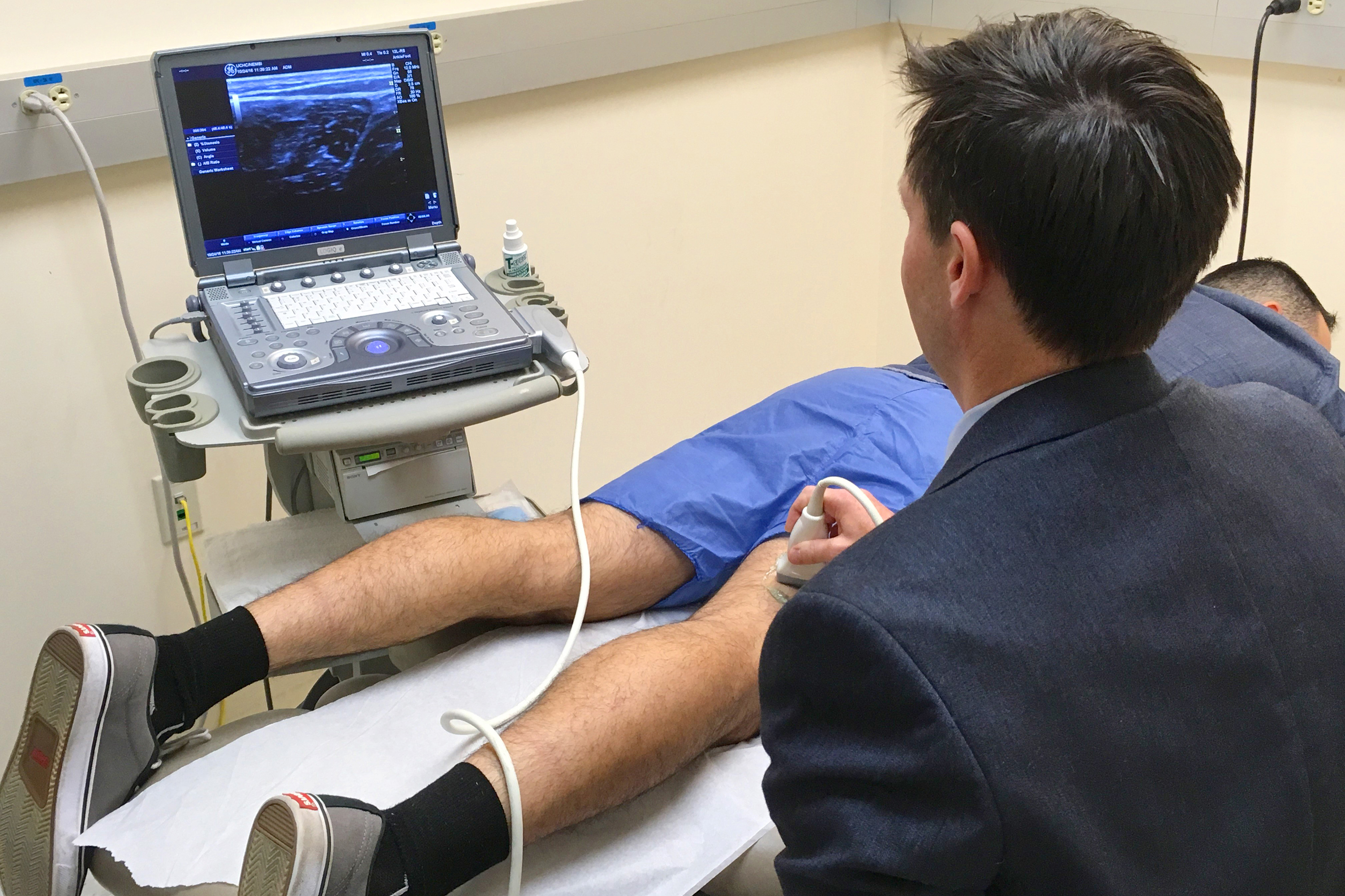 UConn Health sports medicine expert Dr. Cory Edgar performs an ultrasound on baseball player Anthony Giansanti of Montville, Conn. Giansanti was successfully treated for a hamstring injury with an advanced natural treatment called platelet-rich plasma (PRP), followed by physical therapy and rehabilitation. (Lauren Woods/UConn Health Photo)