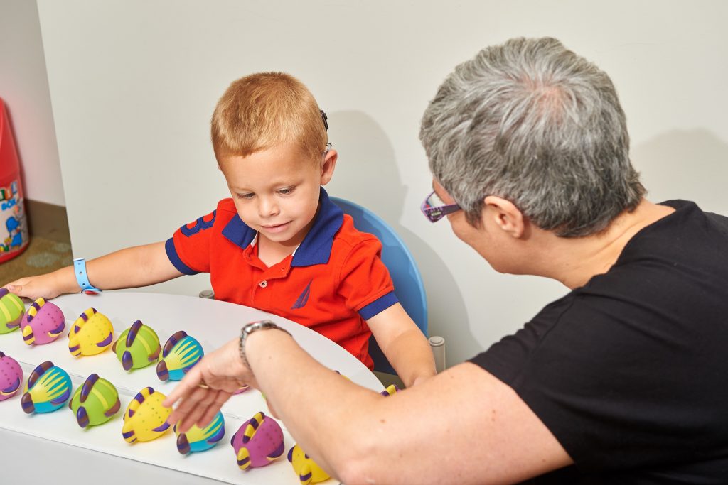 Marie Coppola tests children at the Bousfield Psychology Building. (Peter Morenus/UConn Photo)