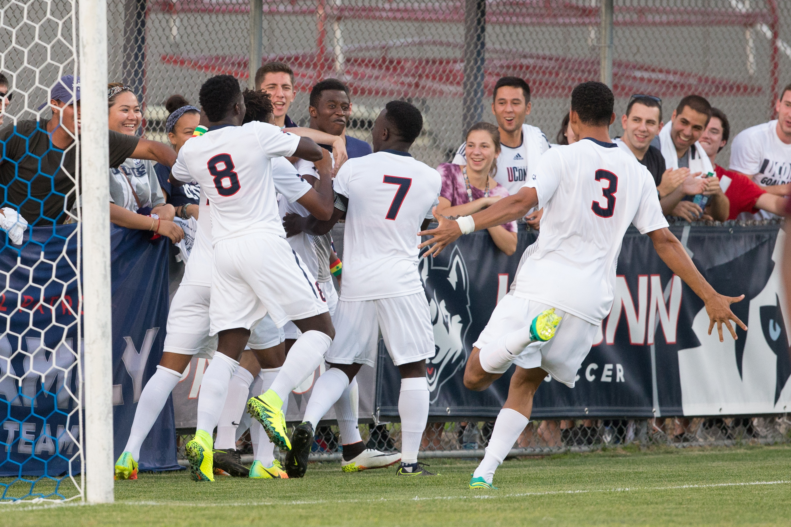 The Huskies celebrate their winning goal against Tulsa on Oct. 1. (Stephen Slade '89 (SFA) for UConn)