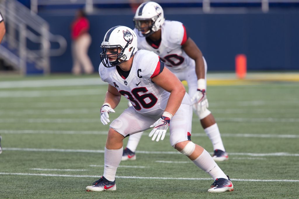 Senior captain Matt Walsh uses his knowledge of both sides of the ball to be an explosive inside linebacker. (Stephen Slade '89 (SFA)/for UConn)